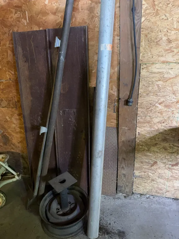 Assorted Metal Scrap Hardware Pipes And Wheel Rim Stand
