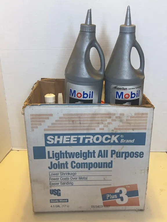 Assorted Automotive Lubricants Including Mobil 1 Lucas Oil Lubriplate