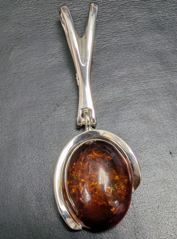 SILVER(6.65G), AMBER PENDANT, SUGGESTED RETAIL VALUE $400