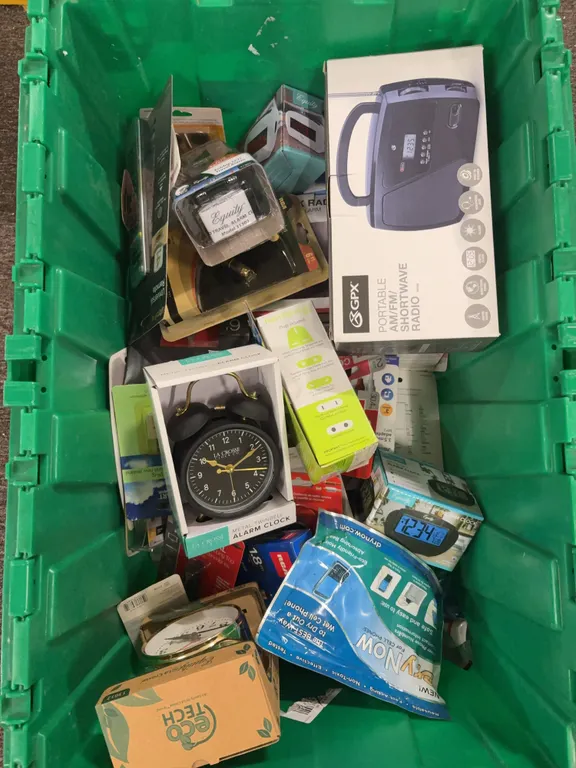 box of alarm clocks cables and adapters Contents only