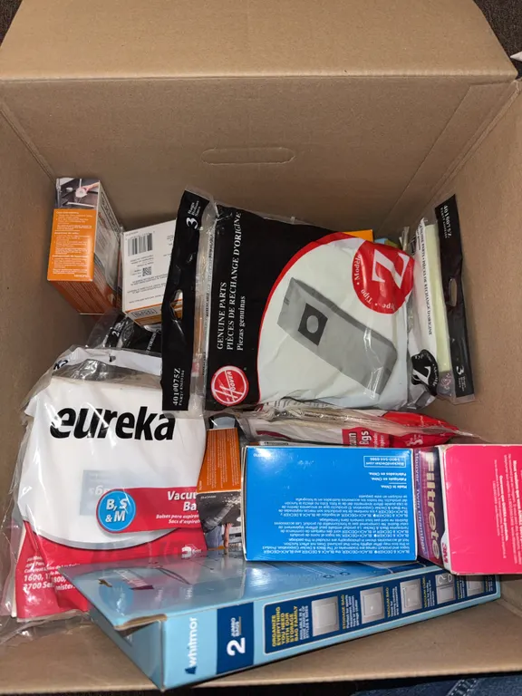 Box of vacuum bags, and filters
