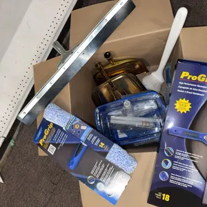 Box of scrubbers squeegee, heads, and dustpan