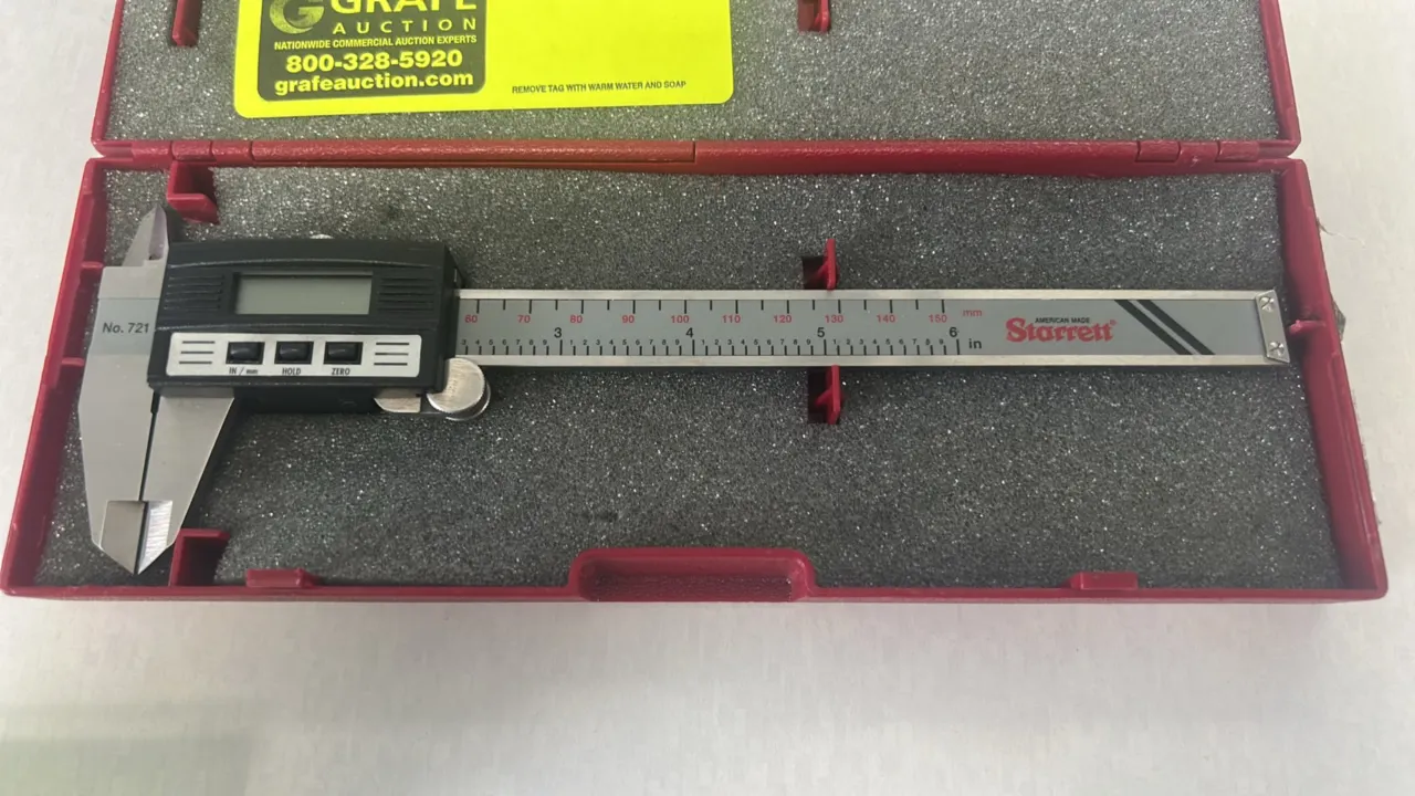 Starrett No. 721 electronic digital caliper. Features an LCD screen with in/mm conversion, hold, and zero functions, thumb roll adjustment, and 6" (15