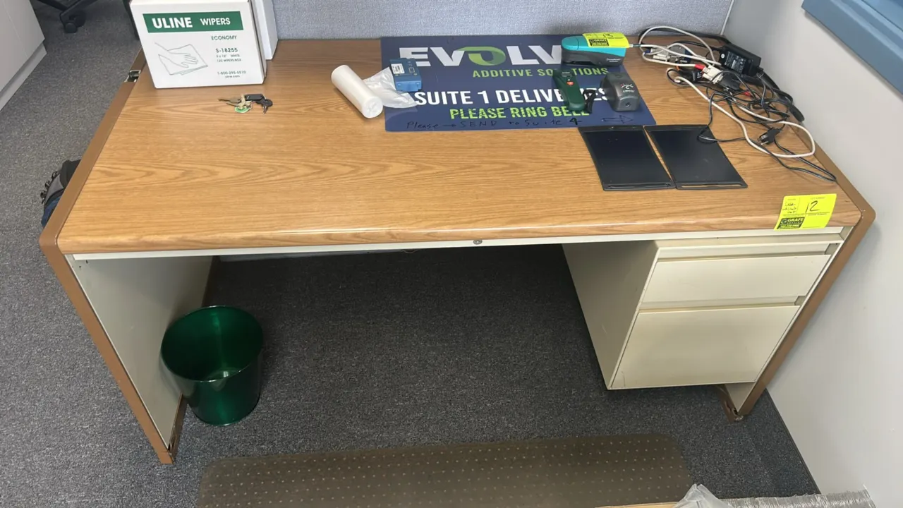 Single pedestal desk with poly chair mat. Features woodgrain laminate top, metal base, right-hand 2-drawer pedestal, and keys. 60"W x 30"D. Desk conte