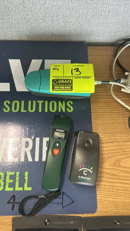 Testing and measurement equipment lot. Includes Extech CO15 carbon monoxide meter, X-Rite DTP34 QuickCal hand-scanning densitometer, and GretagMacbeth