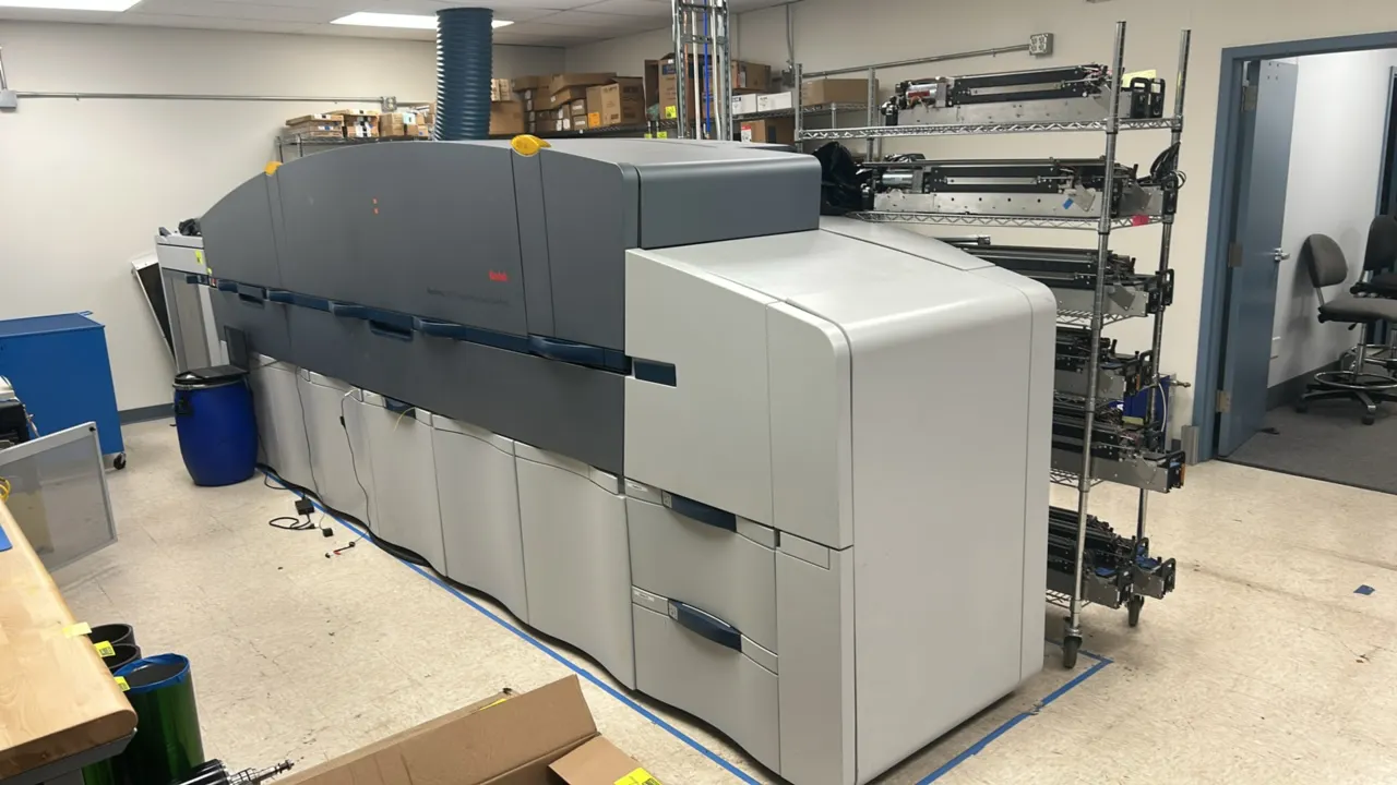 Kodak NexPress S3000 digital production color press. Features 5-color print unit stations, modular sheet-fed design, and top access doors. Note: Wire