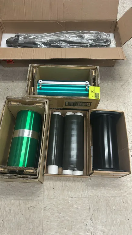 Kodak NexPress extended life imaging cylinders. Includes assorted replacement imaging cylinders and rollers in original cardboard packaging.