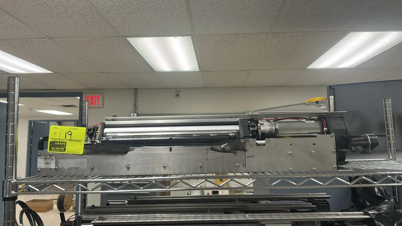 Kodak NexPress 2100 digital production components. Features metal chassis with internal roller assemblies, integrated drive motors, wiring harnesses,