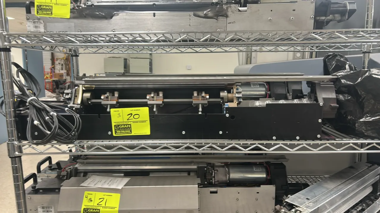 Kodak NexPress 2100 digital production press components. Features integrated electric drive motors, wiring harnesses with multi-pin connectors, and ma