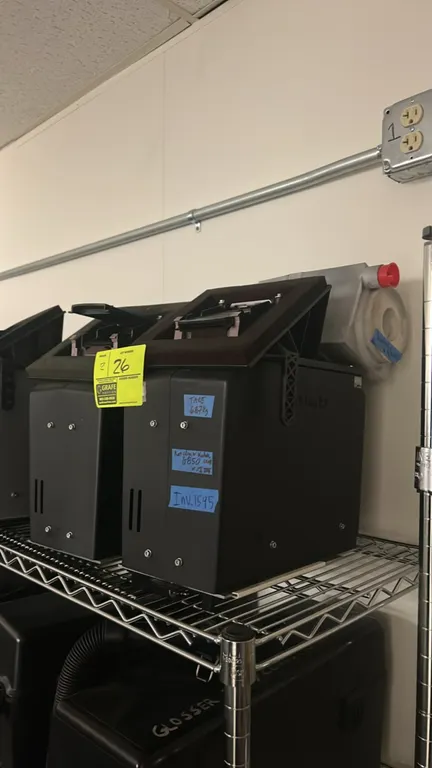 Kodak NexPress 2100 digital production press components. Features black enclosures with top access ports and integrated mounting brackets. Shelving an