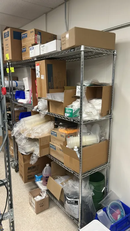 Uline multi-tier portable wire shelving rack. Features stainless steel wire construction with (4) tiers of adjustable wire shelving. 72" x 18". Mounte