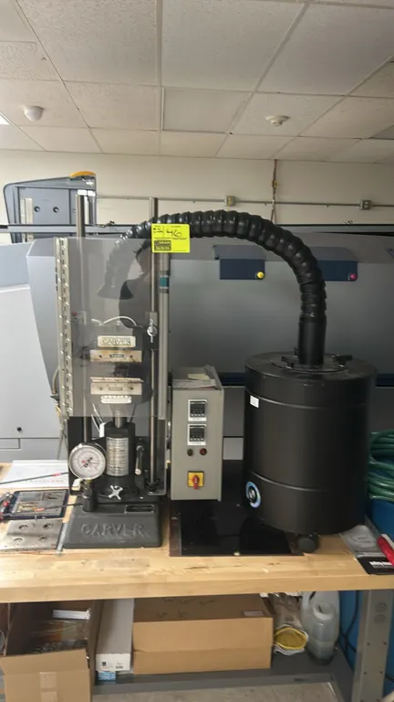 Carver 4386 laboratory hydraulic press. Features model 3912 12-ton hydraulic unit, heated platens with dual West 6100+ digital temperature controllers