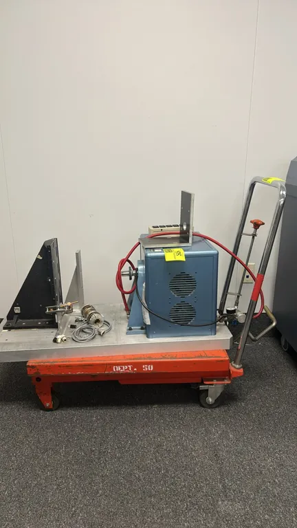 Hydraulic scissor lift table cart. Features foot pump lift operation, manual release valve knob, tubular push handle, and an aluminum tooling plate wi
