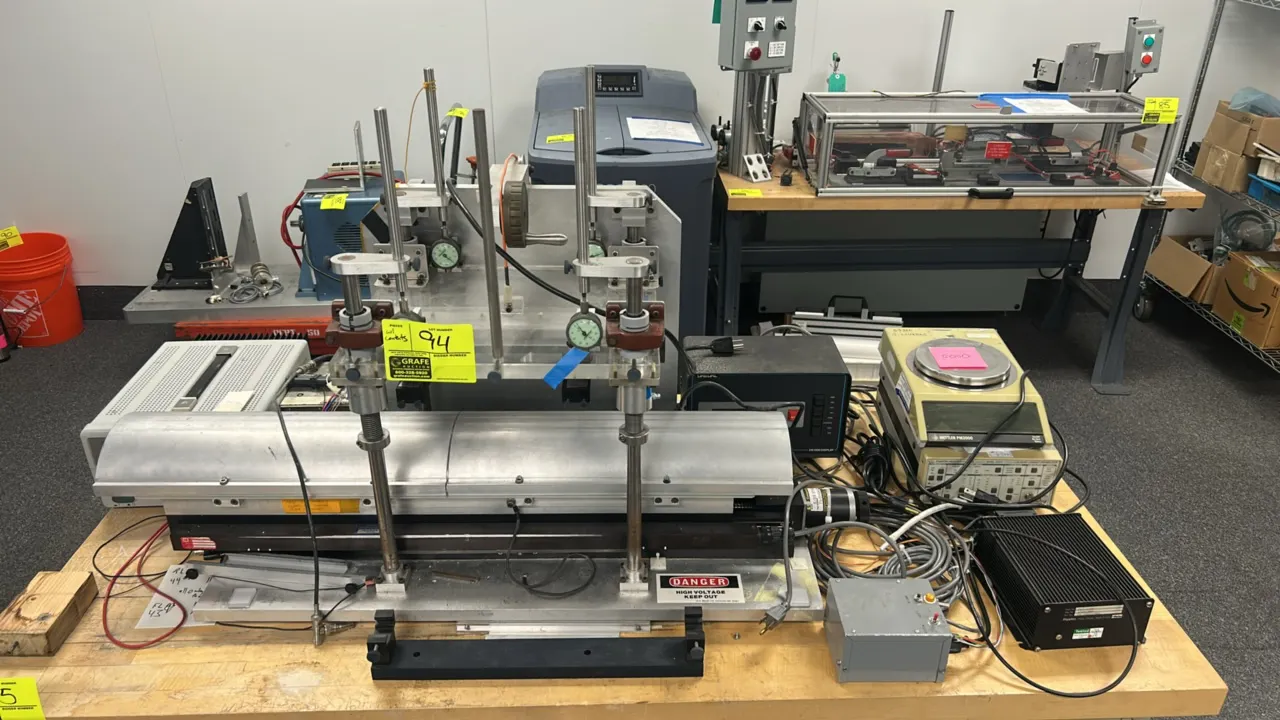 Custom industrial testing apparatus with contents. Includes motorized linear stage with Compumotor stepper motor, Parker Digiplan drive, Mettler PM200