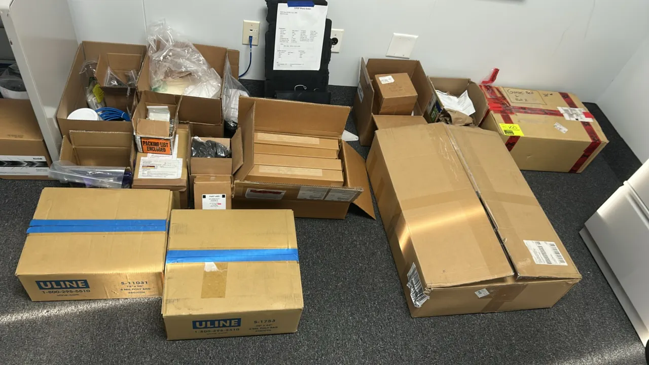 Assorted testing equipment, parts, and materials. Includes stainless steel door assemblies, Gunze belt, McMaster-Carr components, hardware, cabling, p