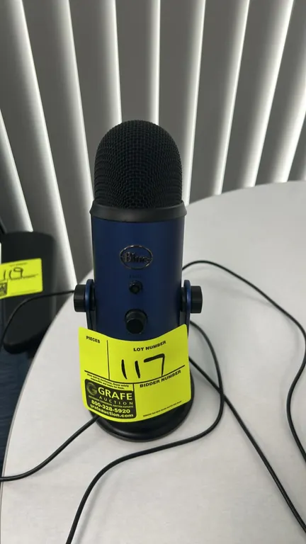 Blue Yeti USB microphone. Features blue finish with black mesh grille, mute button, headphone volume control, gain control, and pattern selection dial
