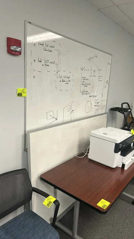 Quartet wall-mounted whiteboards. Features aluminum frames and dry-erase surfaces. Dimensions: 6' x 4' each. Printer, desk, and surrounding items not