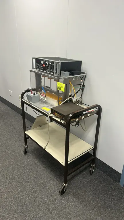 Custom test fixture assembly. Includes a Trek 610C Cor-A-Trol high-voltage power supply/amplifier/controller, Keithley 485 autoranging picoammeter, an