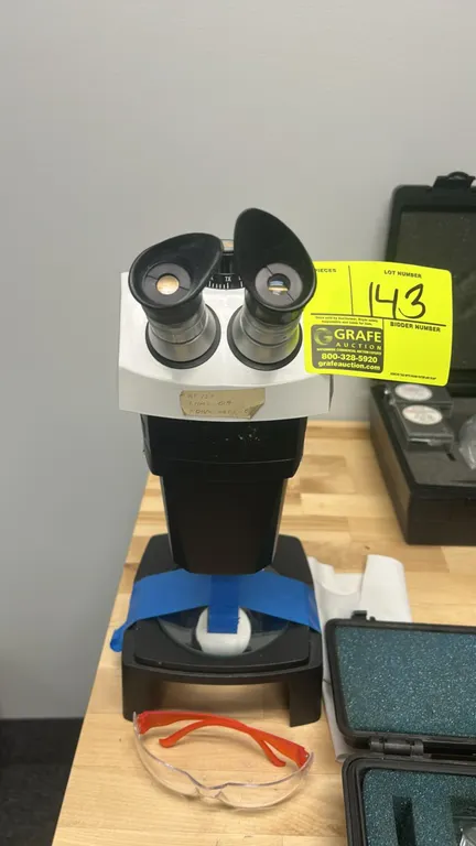 Bausch & Lomb StereoZoom 7 binocular microscope. Features 1.0X-7.0X zoom range, dual eyepieces with rubber eye shields, and adjustable focus stand wit