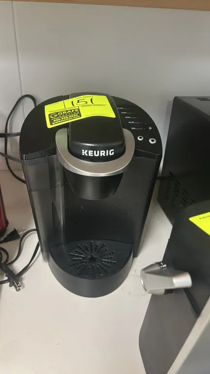 Keurig K-Classic K50 single-serve K-Cup pod coffee maker. Features black housing, removable side water reservoir, removable drip tray, and push-button