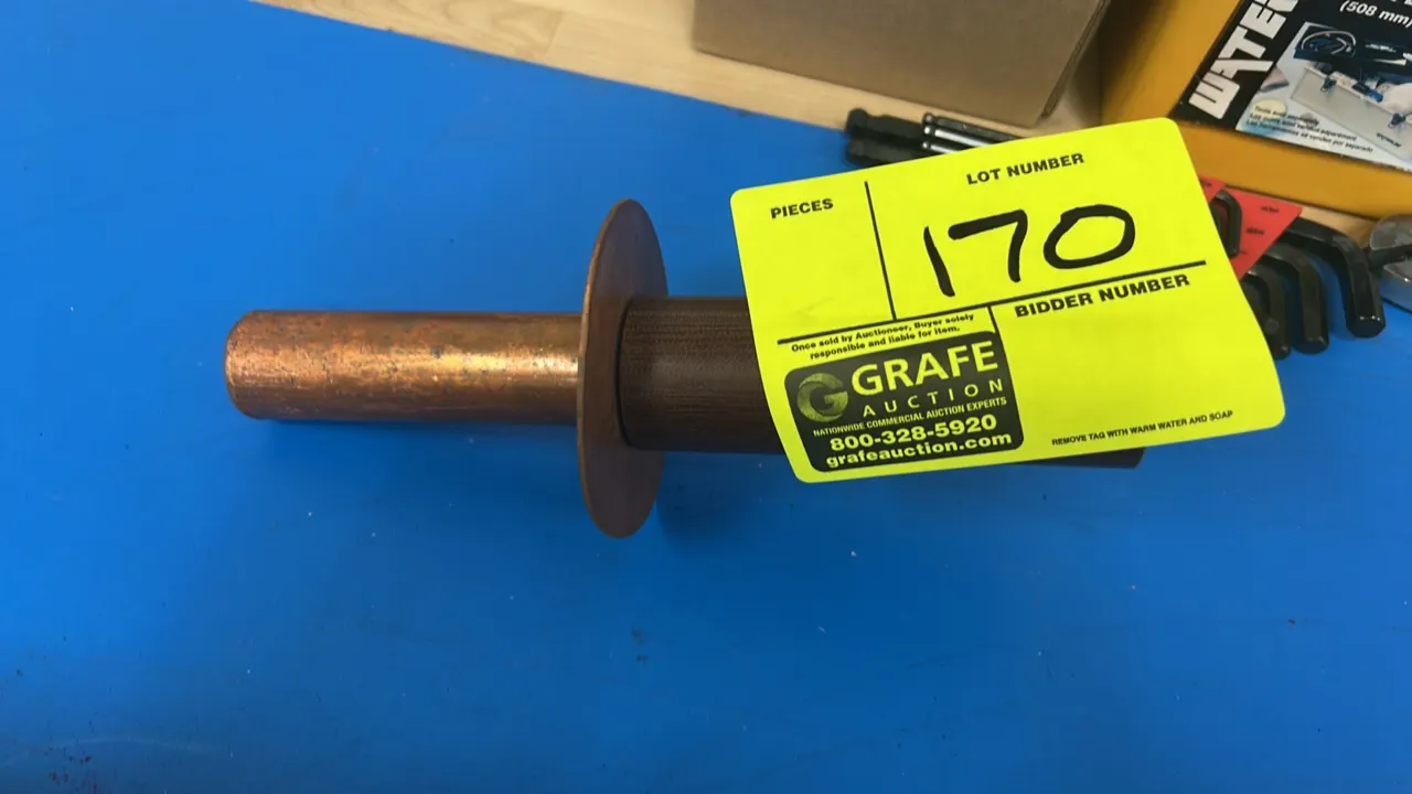 Copper rivet with washer and driver tool. Features copper rivet body, copper washer, and a steel pilot installation tool with composite handle sleeve.