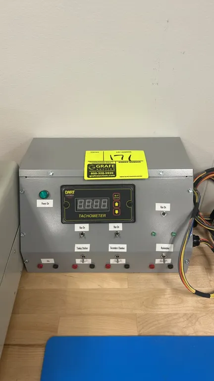Dart Controls DM8000 4-in-1 programmable tachometer. Housed in a slope-front metal benchtop enclosure. Features a digital LED display, keypad controls