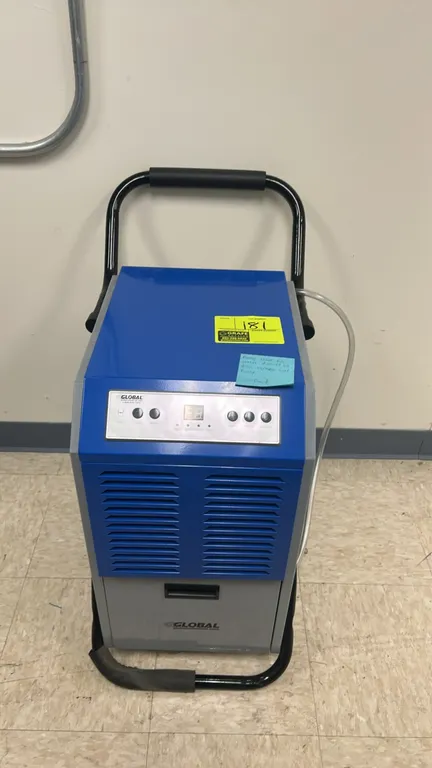 2021 Global Industrial OL50-503E commercial portable dehumidifier. Features digital control panel, front intake louvers, internal condensate collectio
