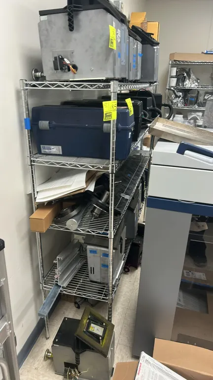 Uline 4-tier wire shelving rack. Features stainless steel wire construction with (4) adjustable shelves. Dimensions: 72" x 18". Contents not included.
