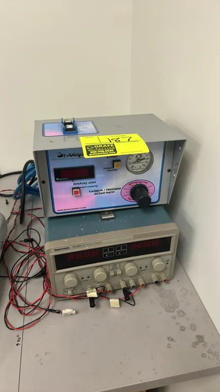 Tektronix PS280 DC power supply with Snoops II vacuum/pressure control unit. Power supply features triple outputs (dual 0-30V 2A and fixed 5V 3A) with