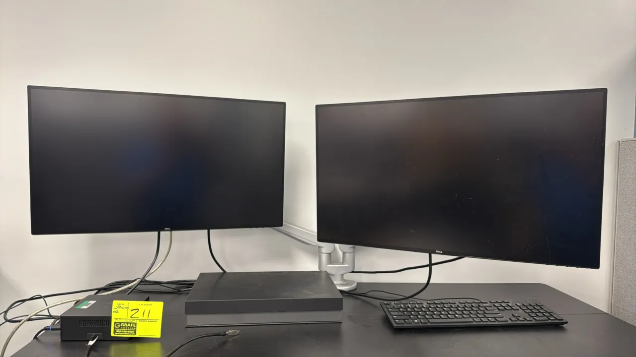 Dell computer workstation setup. Includes Dell TB16 (Reg Model K16A) docking station, (2) 2018 Dell U2717D 27" flat panel monitors, dual articulating
