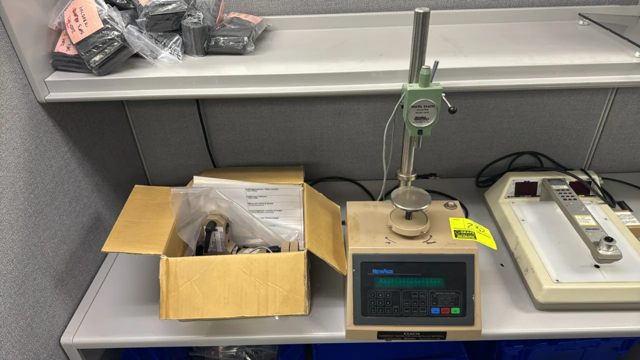NewAge Exacta EX200 IRM hardness tester for non-metallic materials. Features Micro IRHD digital gauge head, vertical post with adjustable height stage