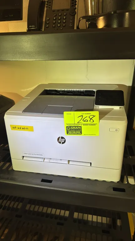 HP Color LaserJet Pro M255dw laser printer. Features color touchscreen control panel, front-loading paper tray, and single-sheet feed slot.