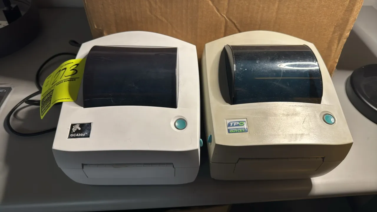 Zebra GC420d and TPO desktop direct thermal printers. Features 4" print width capability, clamshell design, and top media viewing windows.