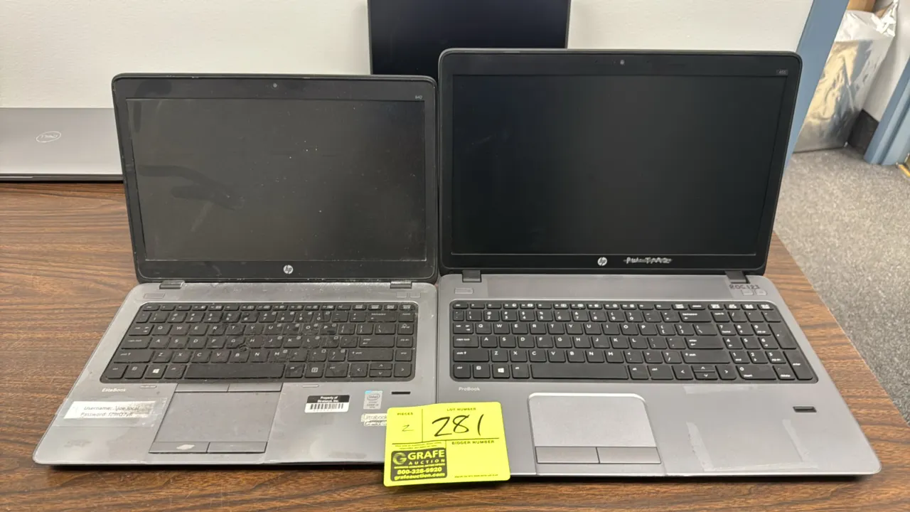 HP laptops. Includes (1) EliteBook 840 and (1) ProBook. Features 14" and 16" screens, integrated webcams, trackpads, and keyboards. ProBook includes a