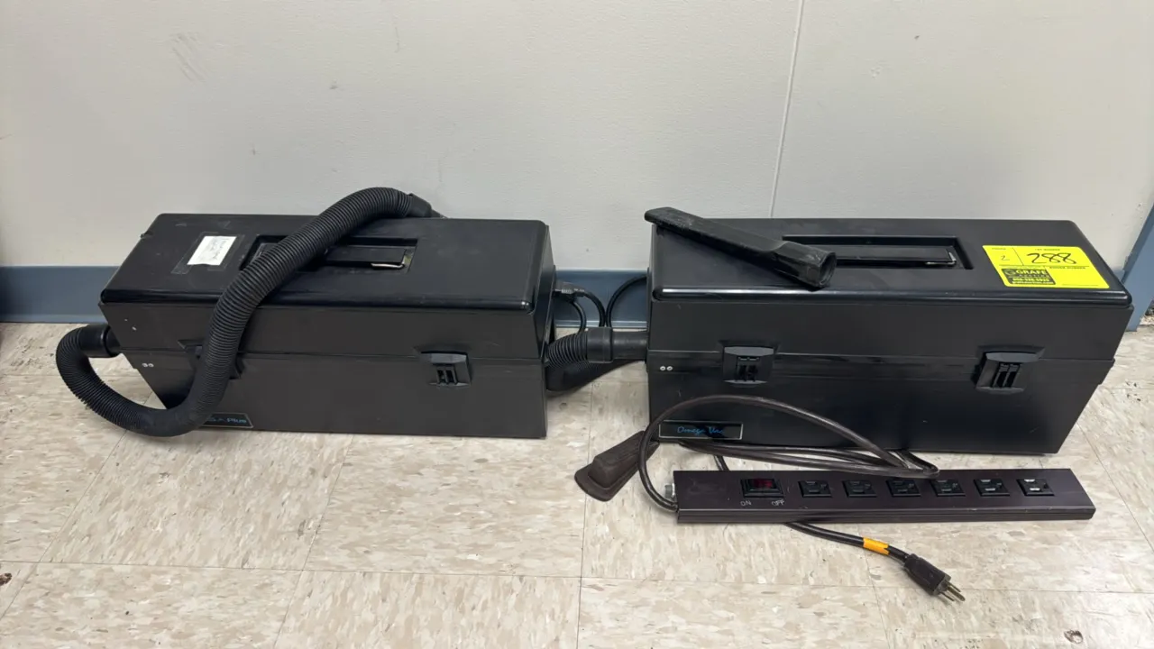 Omega Vac electronic service vacuums. Features portable toolbox-style cases with top carry handles. Includes flexible hoses, attachments, and 6-outlet