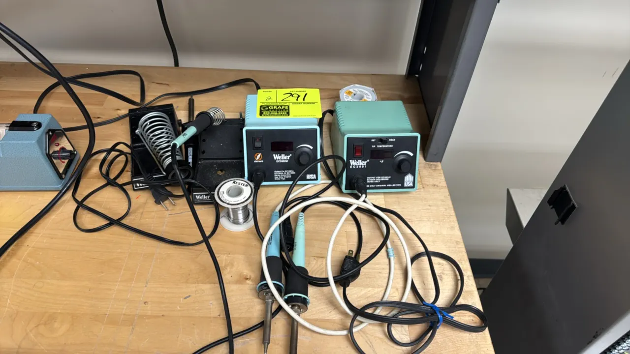Weller EC2001 and EC2002M soldering stations. Features digital temperature displays and rotary temperature adjustment dials. Includes (2) temperature-