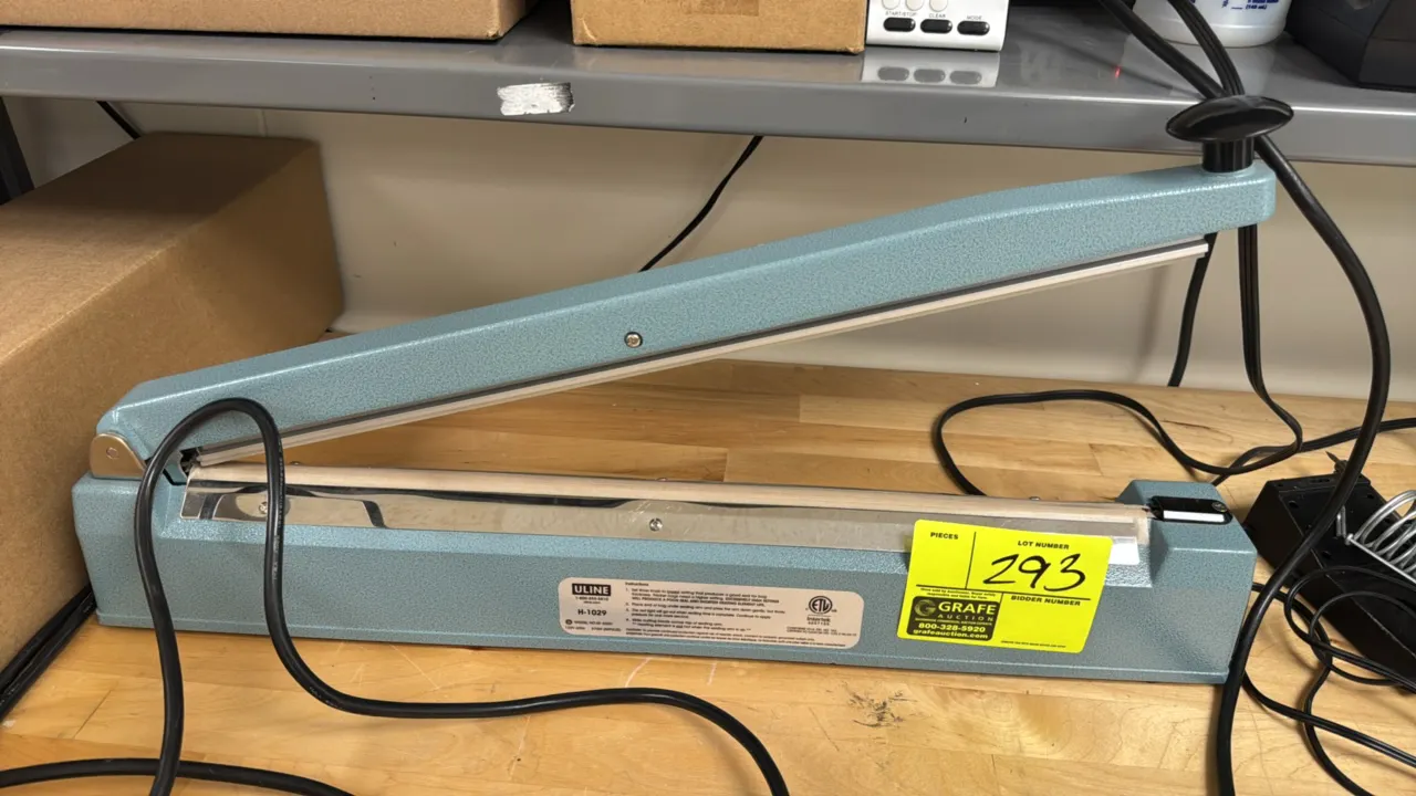 Uline H-1029 20" impulse sealer. Features integrated sliding cutting blade, adjustable timer knob, and indicator light. Electrical: 120V, 60 Hz, 870W.