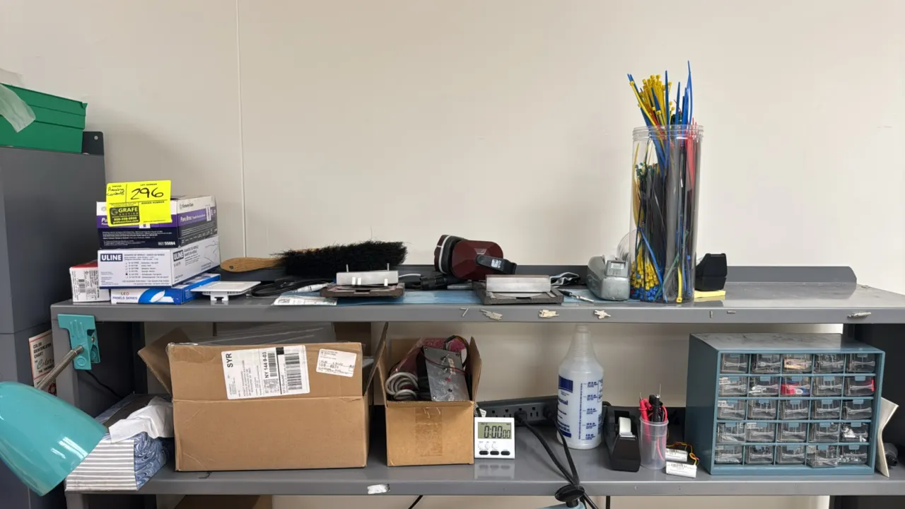Package lot of assorted workbench contents and supplies. Includes multi-drawer hardware organizer with assorted hardware, container of cable ties, ear