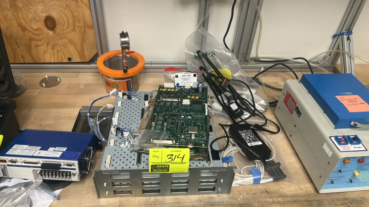 Assorted electrical components and equipment package. Includes BACOENG vacuum chamber with vacuum gauge, Kollmorgen SERVOSTAR CD servo drive (Model CR