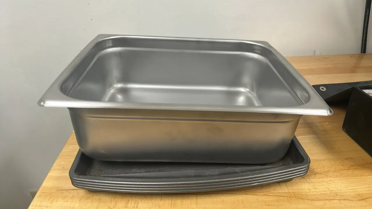 Assorted kitchen pans. Includes (1) 13" aluminum insert pan and (5) 19" metal sheet pans with rolled rims.