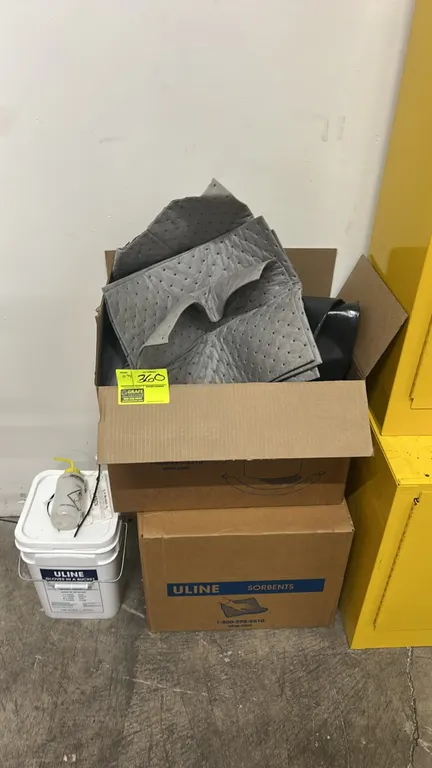 Assorted safety and spill cleanup supplies. Includes Uline dimpled universal absorbent pads, Ansell AlphaTec chemical-resistant gloves (09-430), Uline