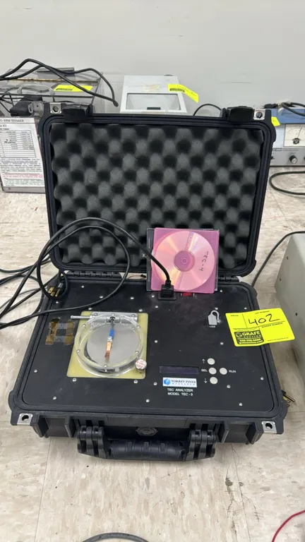 Torrey Pines Research TEC-3 TEC analyzer. Features digital display, pushbutton controls, USB interface, and circular test fixture. Integrated into a r
