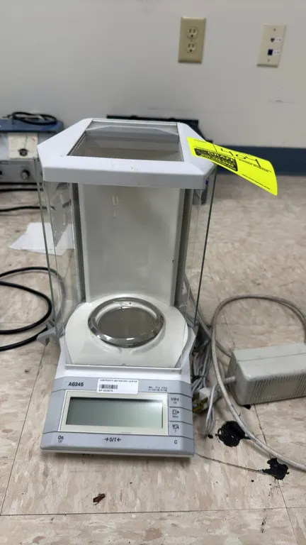 Mettler Toledo AG245 laboratory electronic analytical balance. Features dual range capacity of 41g and 210g with 0.01mg and 0.1mg readability, glass d