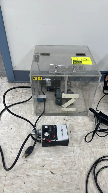 Minarik long-arm laboratory shaker. Features clear acrylic hinged enclosure, 6-place clamp rack, and external Minarik variable speed controller with f