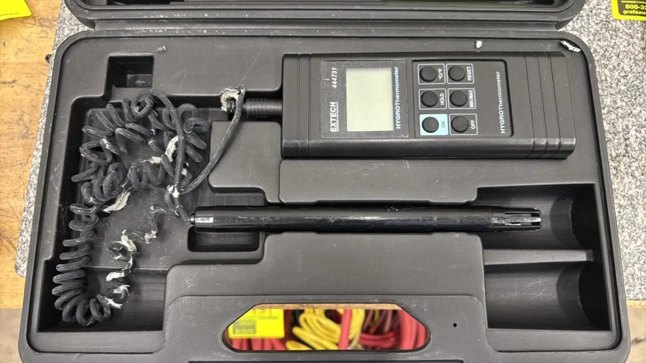 Extech 444731 hygro-thermometer. Features digital LCD display, remote probe with coiled cable, Min/Max recall, data hold, and hard molded storage case