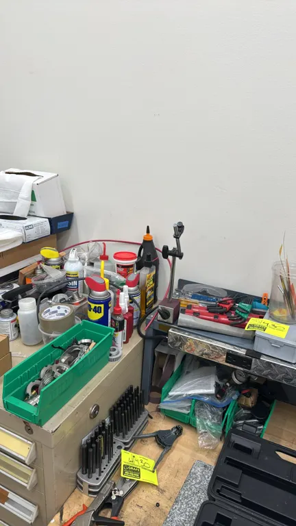 Package lot of assorted tooling, shop supplies, and hardware. Includes SPI magnetic base indicator stand, letter and number punch sets with stands, ca