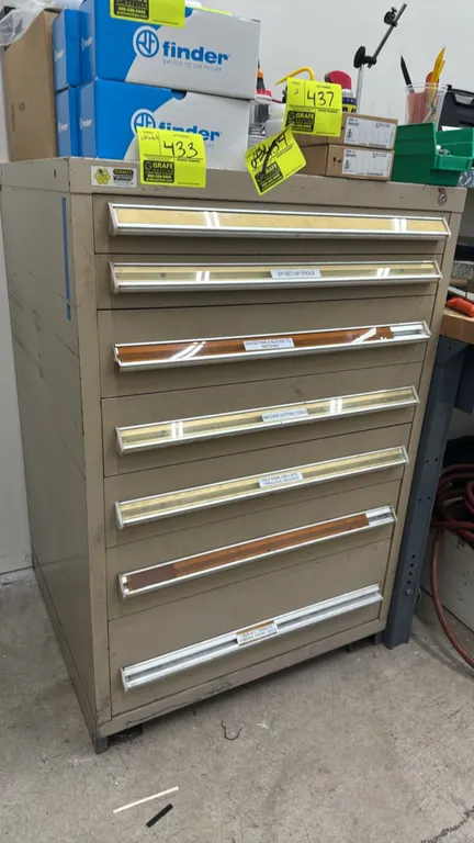 Stanley Vidmar 7-drawer metal cabinet. Features full-width aluminum pull handles with label slots and internal dividers. 30" x 28" x 45". Includes var