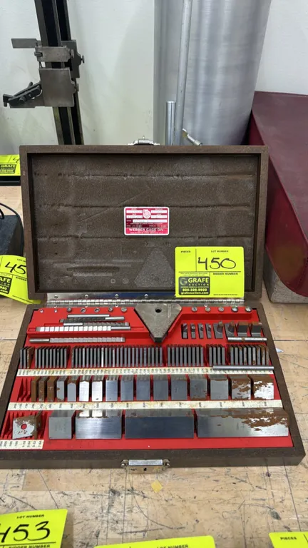 1984 Webber Gage SS84A1X steel gage block set. Includes Grade 2 steel gage blocks and accessories housed in a fitted case. S/N: 72384.7. Note: Surface
