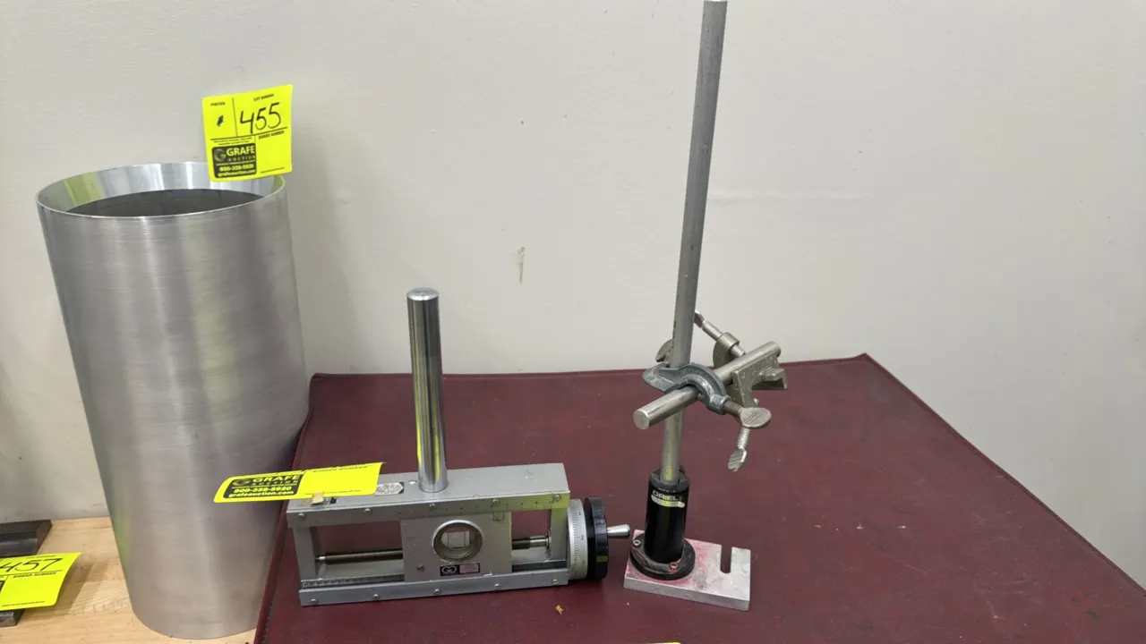Oriel stand with clamps and Gaertner micrometer slide. Includes Oriel post holder with vertical rod and dual clamp assembly, and Gaertner Scientific l