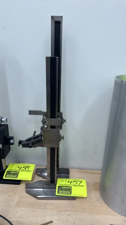 Standard vernier height gauges. Includes (1) 17 1/2" gauge and (1) 21 1/2" gauge. Features adjustable sliding carriages with fine-adjustment thumb scr